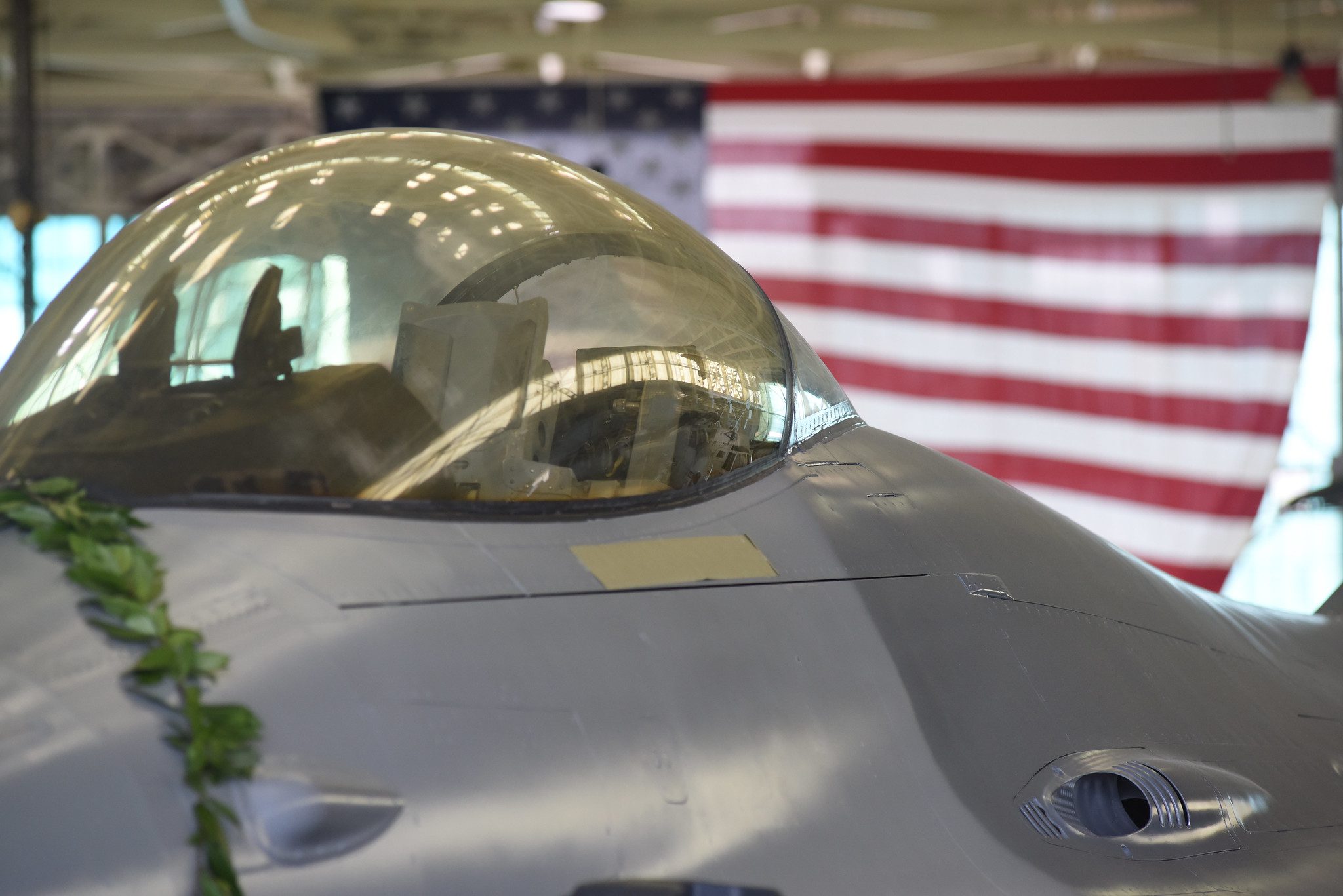 Photo of Jet with a flag hanging in the background